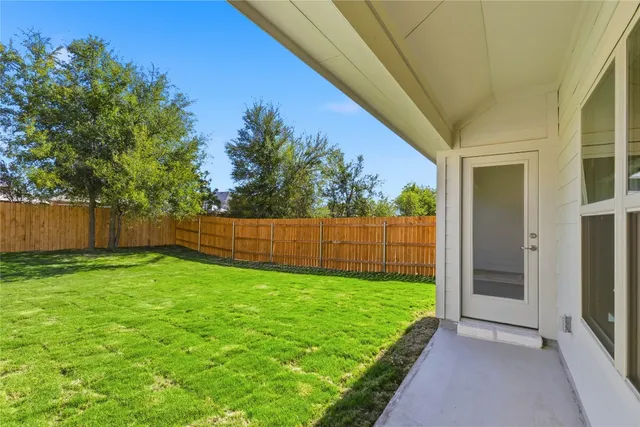 a view of a backyard with a garden