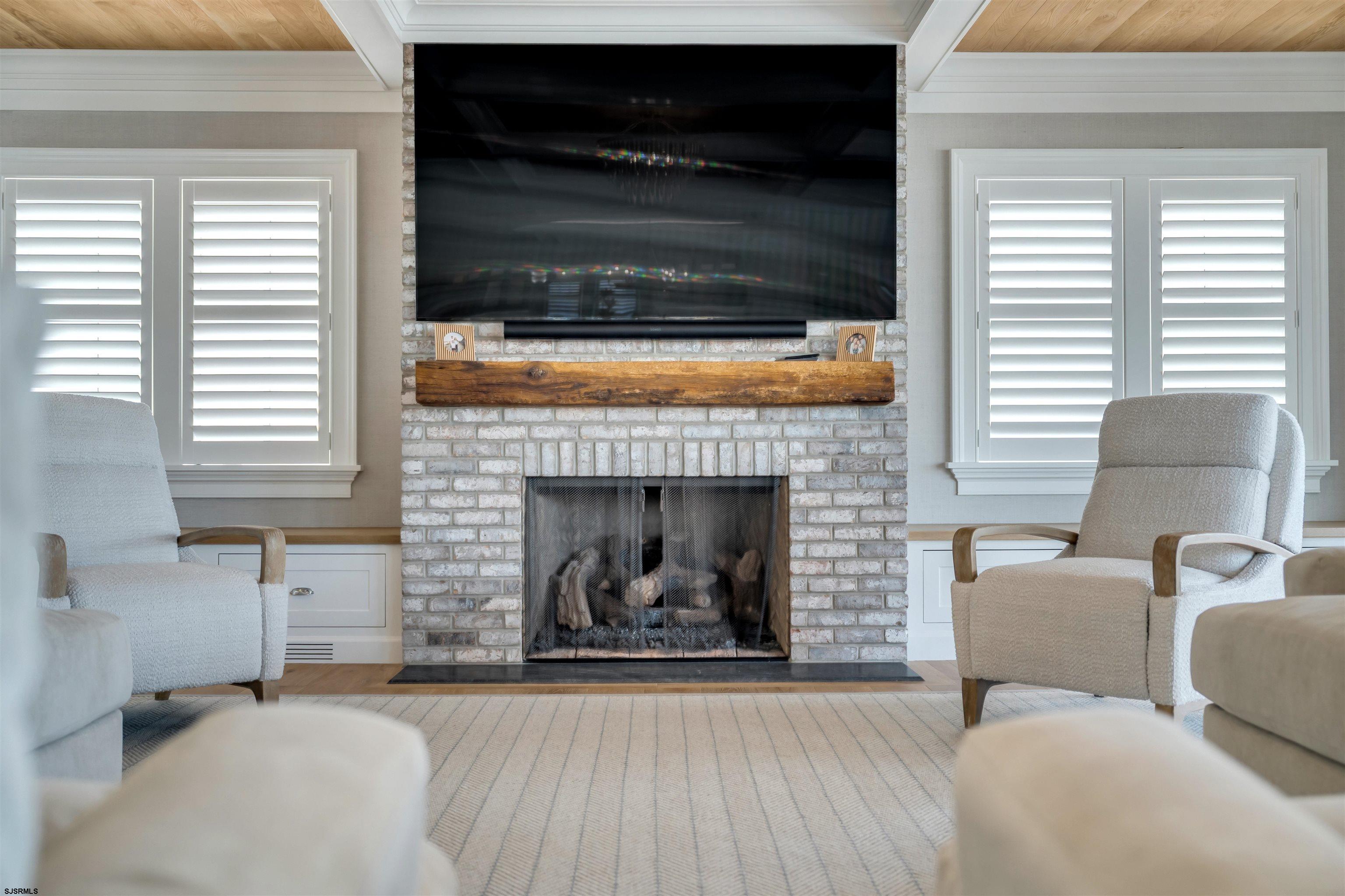 55 Walnut Road Ocean City, NJ 08226 - Photo 14 of 97 a living room with furniture and a fireplace
