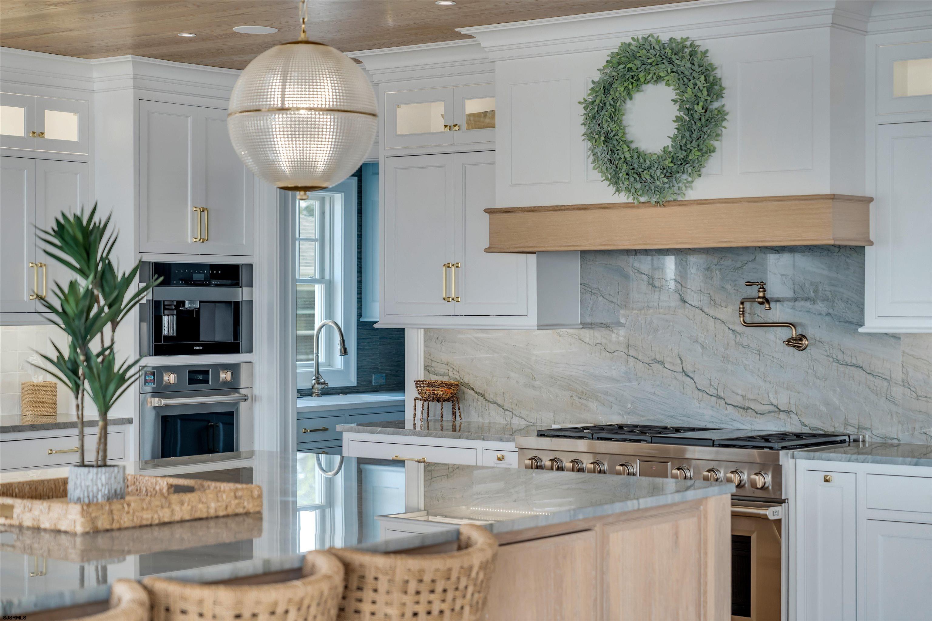 55 Walnut Road Ocean City, NJ 08226 - Photo 33 of 97 a kitchen with a table and chairs in it