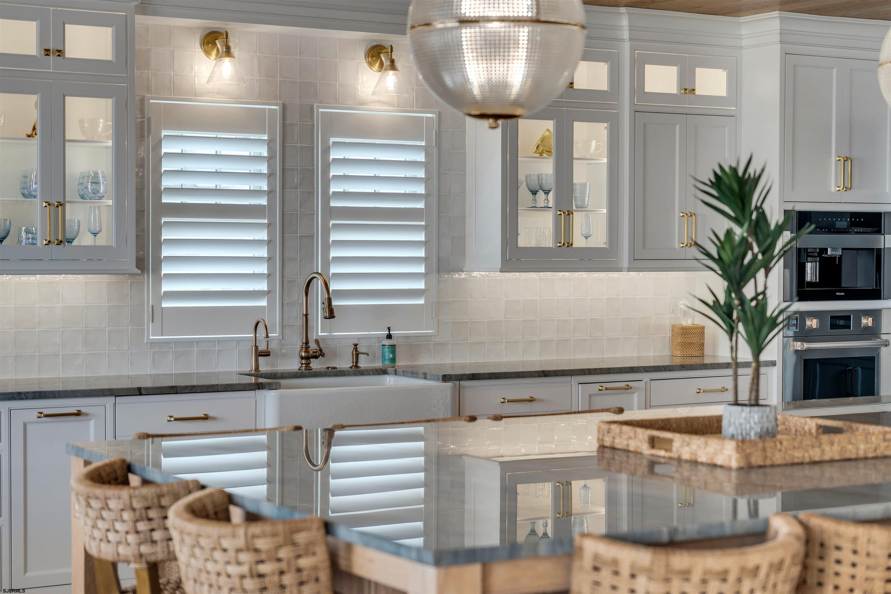 55 Walnut Road Ocean City, NJ 08226 - Photo 37 of 97 a kitchen with a table and chairs