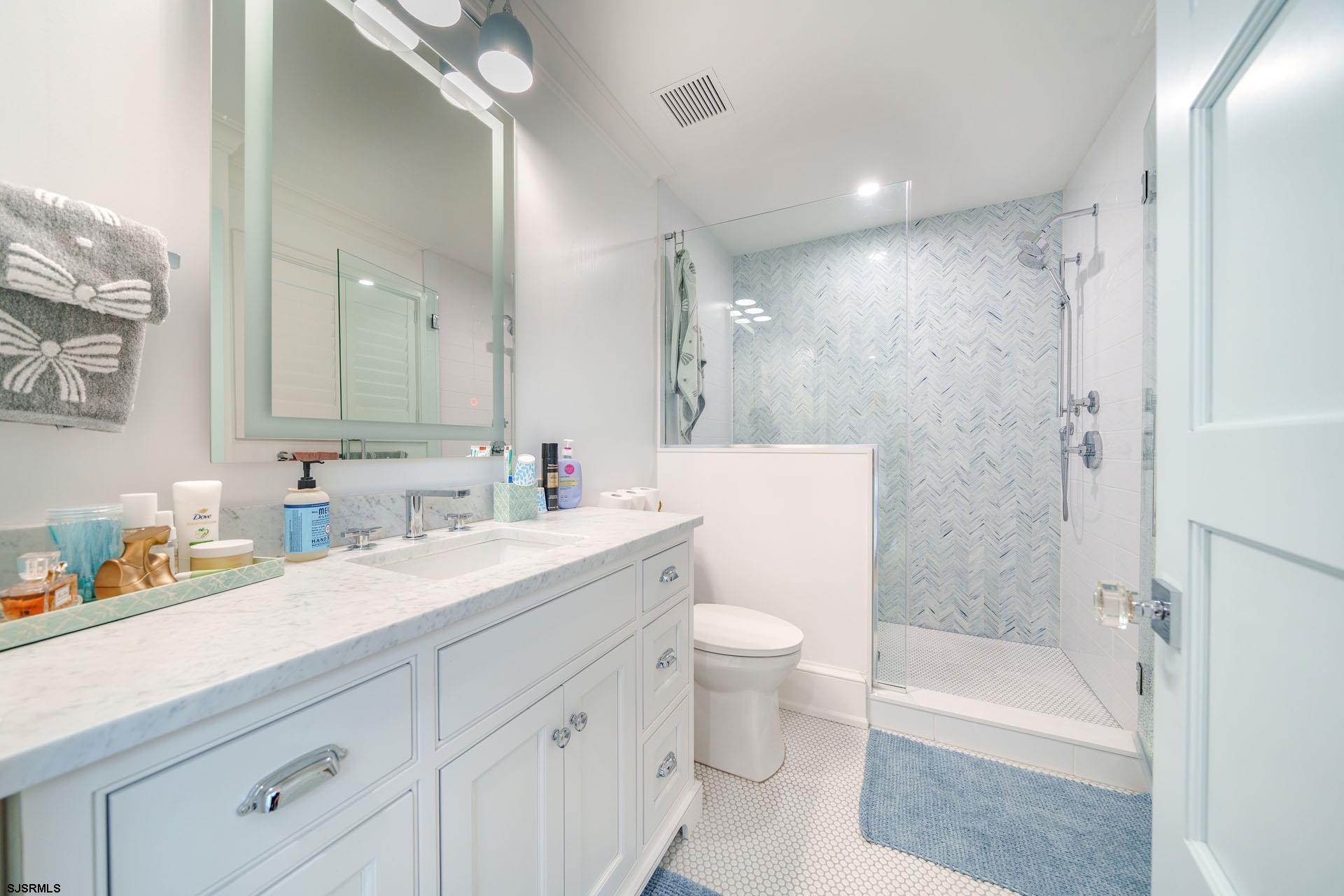 55 Walnut Road Ocean City, NJ 08226 - Photo 53 of 97 a bathroom with a sink a toilet and a bathtub