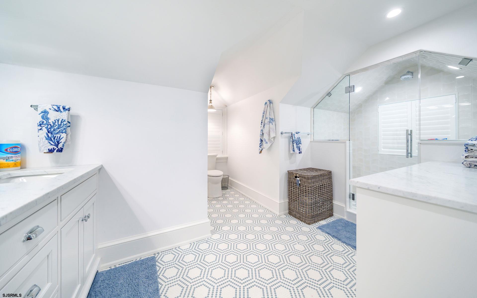 55 Walnut Road Ocean City, NJ 08226 - Photo 65 of 97 a spacious bathroom with a sink a mirror and a shower