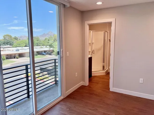 a bathroom with a shower and a sink