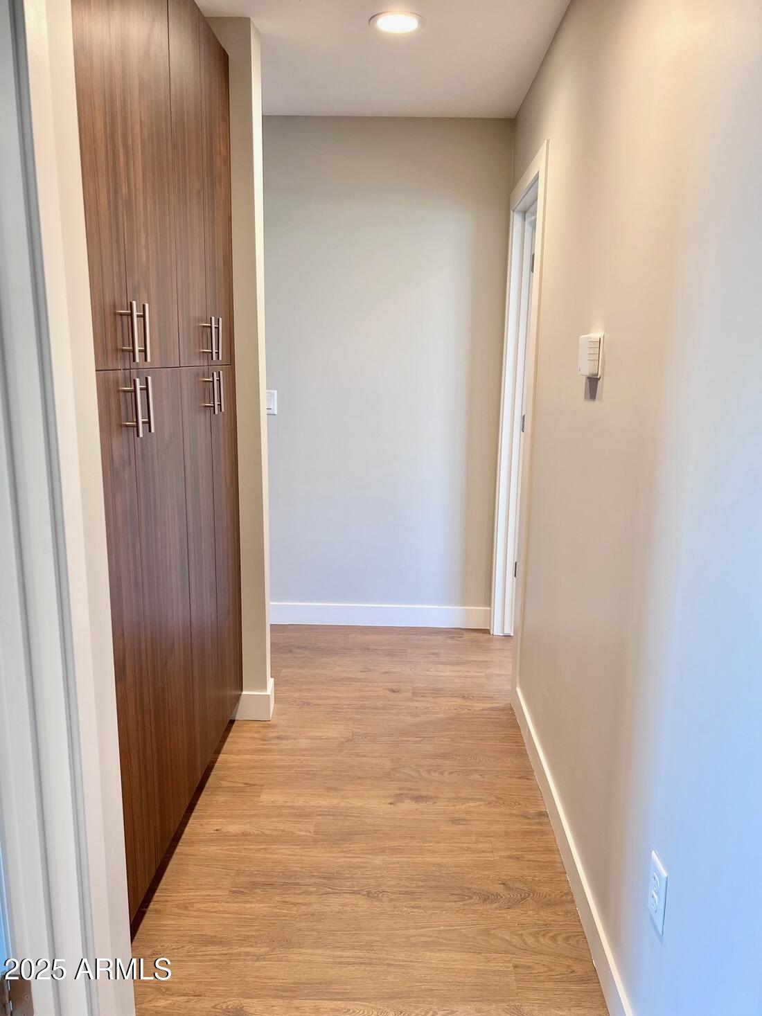 915 East Missouri Avenue, Unit 10 Phoenix, AZ 85014 - Photo 24 of 61 a view of an empty room with wooden floor