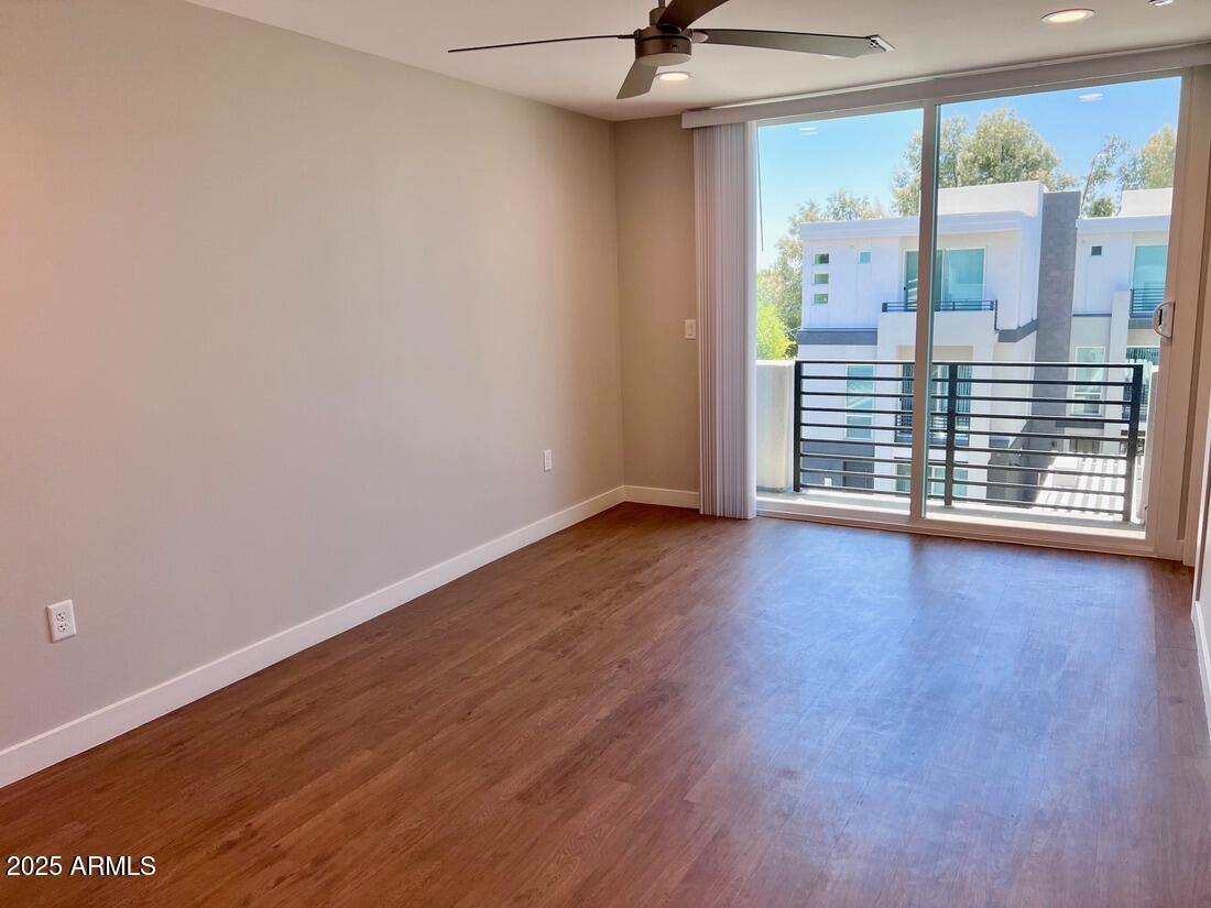 915 East Missouri Avenue, Unit 10 Phoenix, AZ 85014 - Photo 25 of 61 wooden floor in an empty room with a window