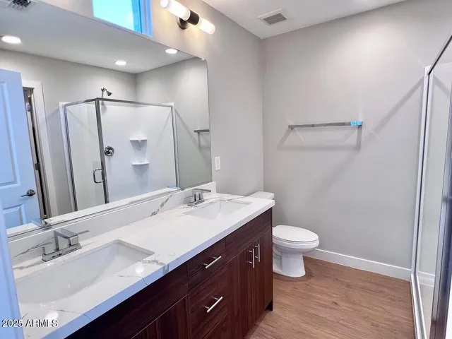 a bathroom with a glass shower door