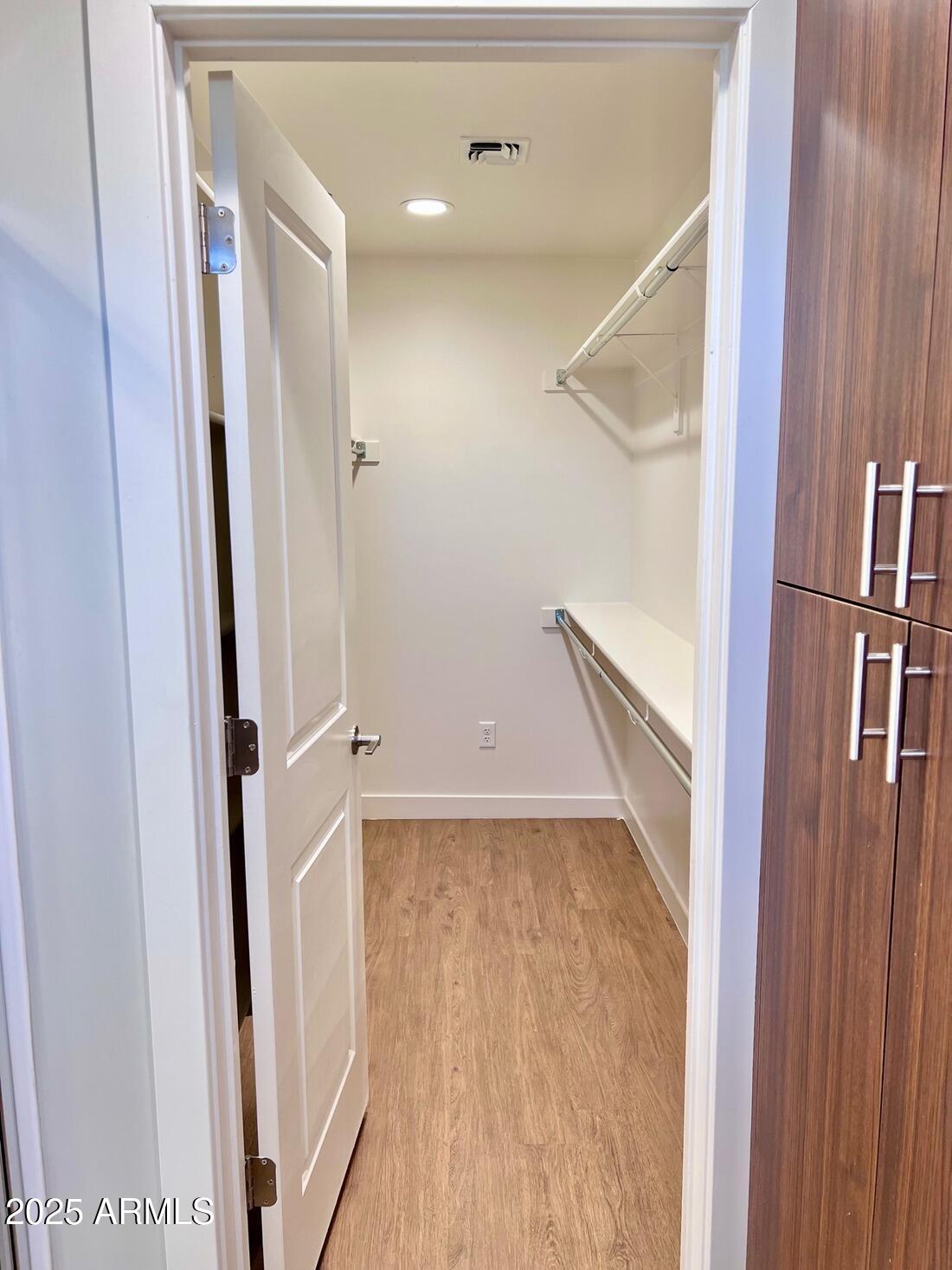 915 East Missouri Avenue, Unit 10 Phoenix, AZ 85014 - Photo 34 of 61 a view of a hallway with wooden floor and staircase