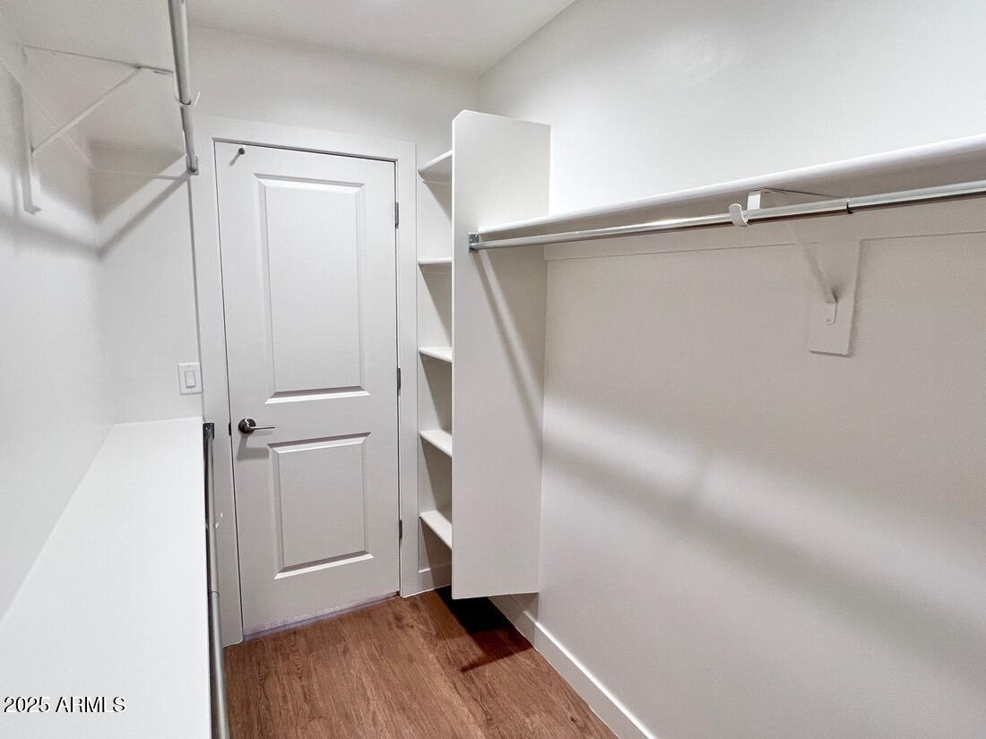 915 East Missouri Avenue, Unit 10 Phoenix, AZ 85014 - Photo 35 of 61 a view of walk in closet with empty racks