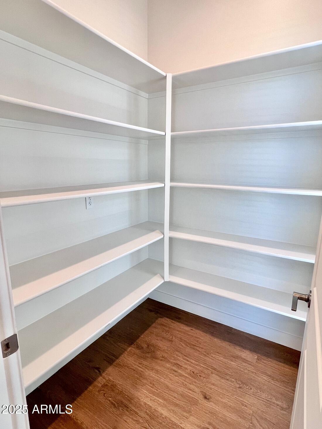 915 East Missouri Avenue, Unit 10 Phoenix, AZ 85014 - Photo 9 of 61 a view of walk in closet with empty racks