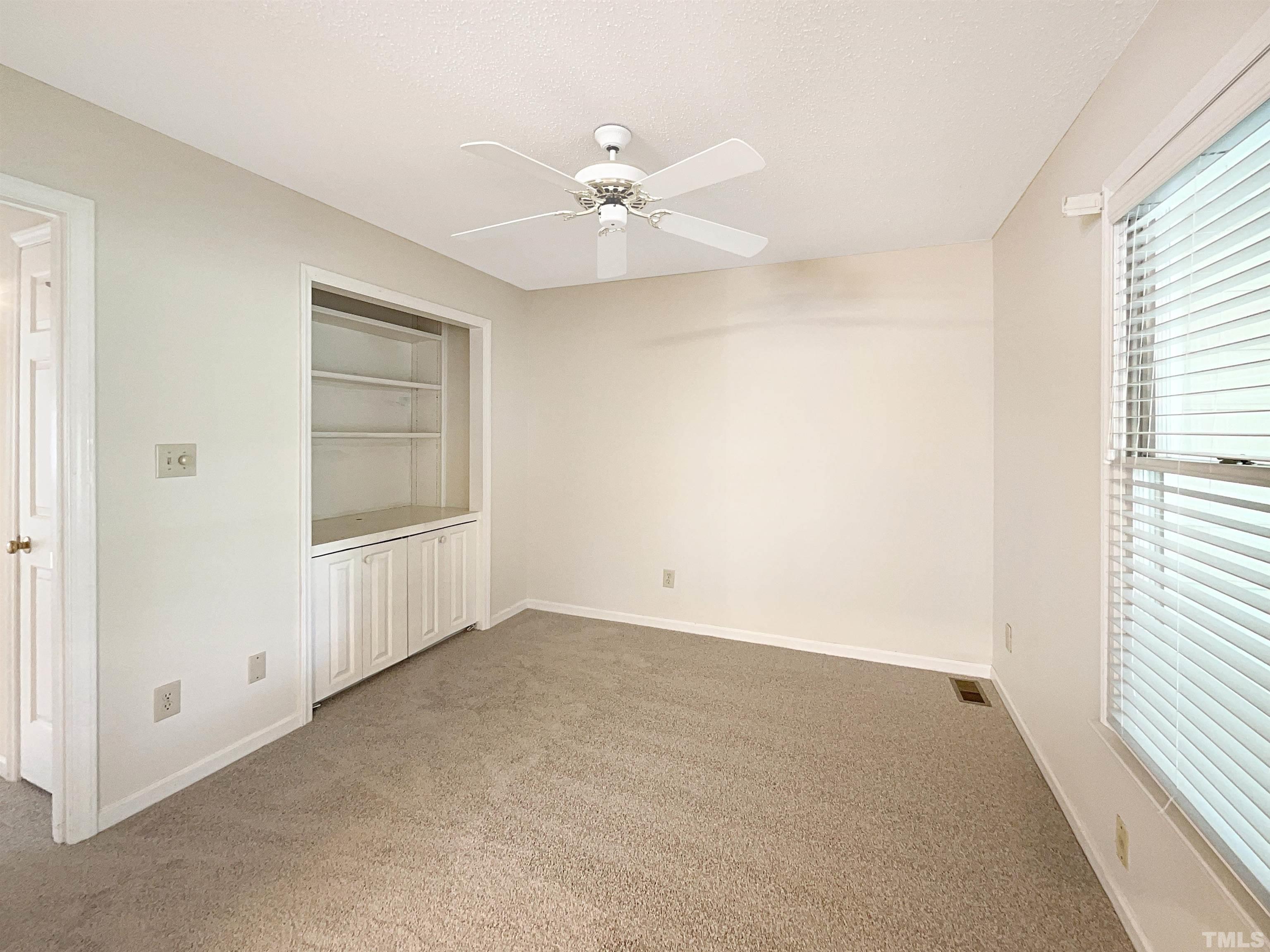 1749 Kingston Heath Way Raleigh, NC 27604 - Photo 12 of 19 a view of an empty room with a window