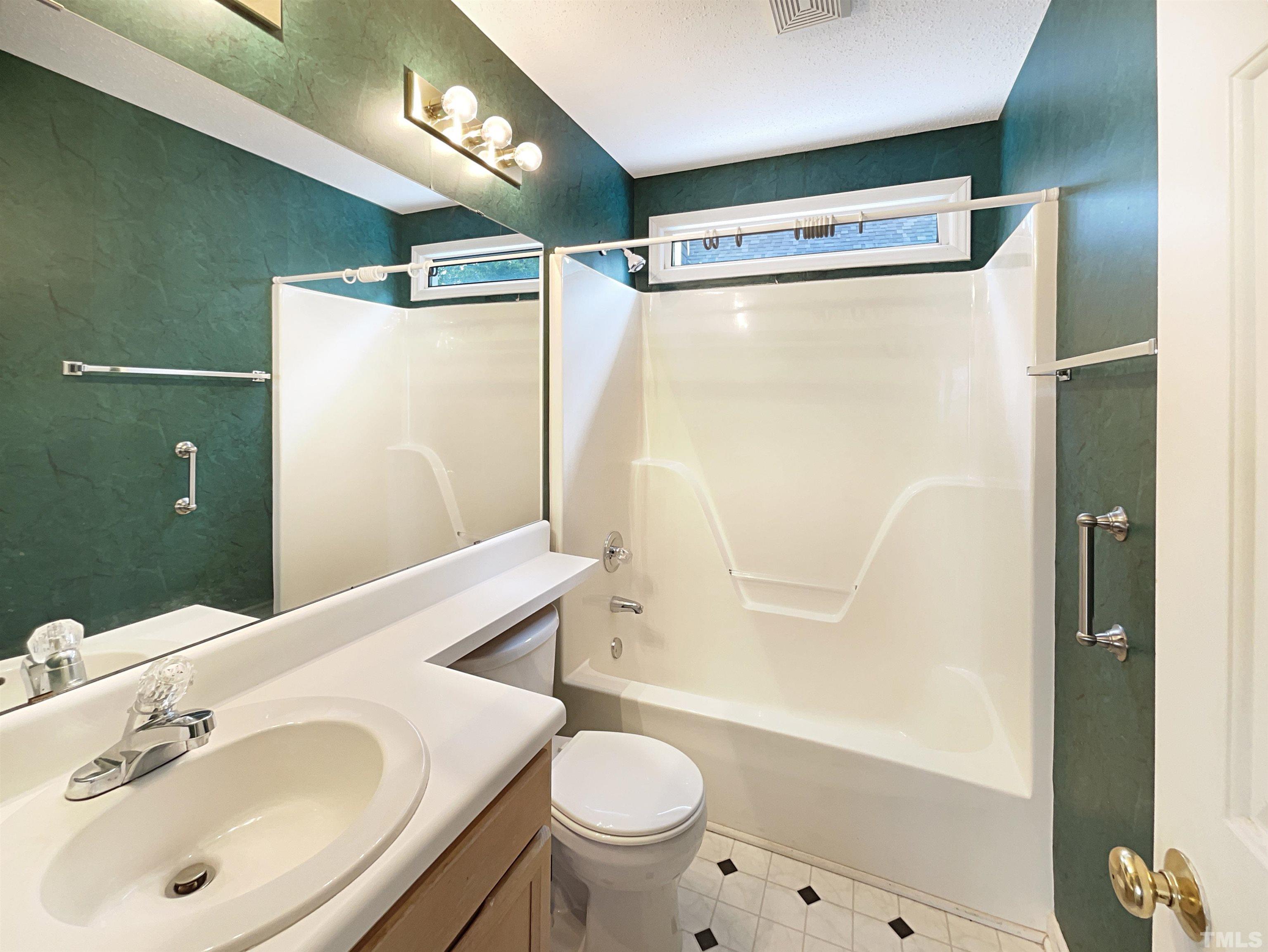 1749 Kingston Heath Way Raleigh, NC 27604 - Photo 13 of 19 a bathroom with a sink toilet and shower