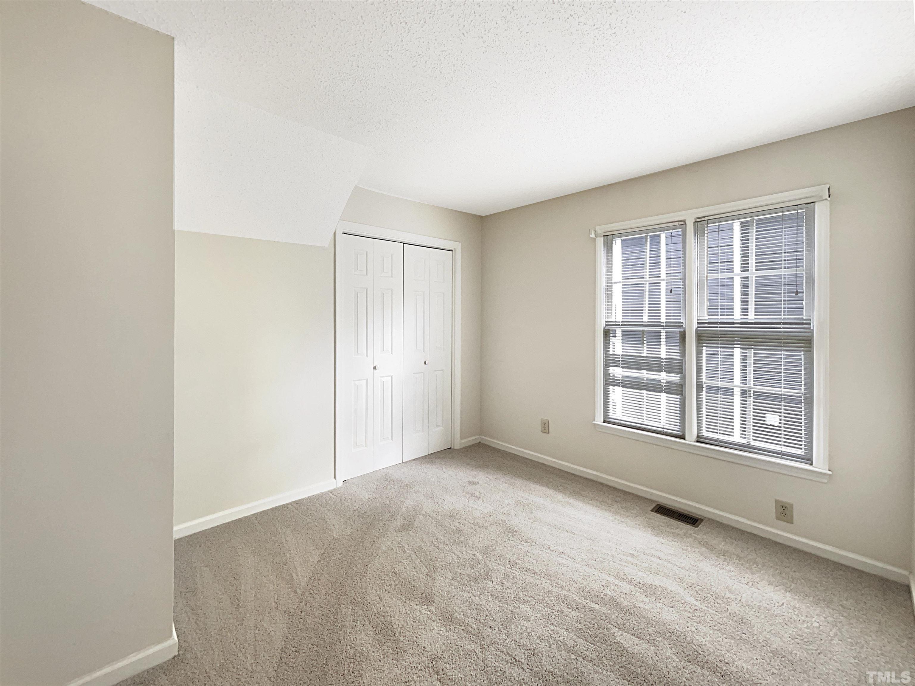 1749 Kingston Heath Way Raleigh, NC 27604 - Photo 14 of 19 an empty room with windows