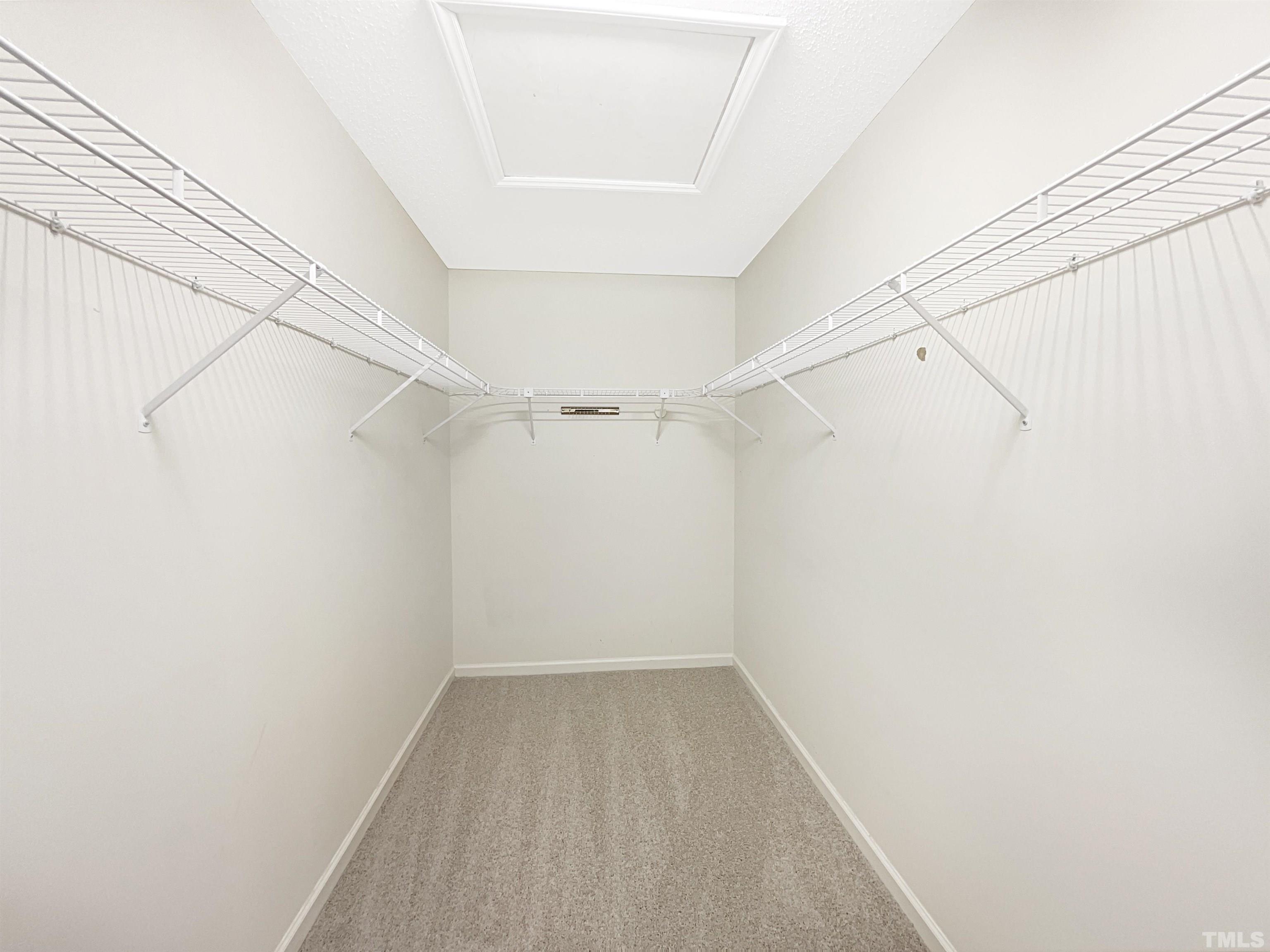 1749 Kingston Heath Way Raleigh, NC 27604 - Photo 17 of 19 a view of a room with racks on the wall