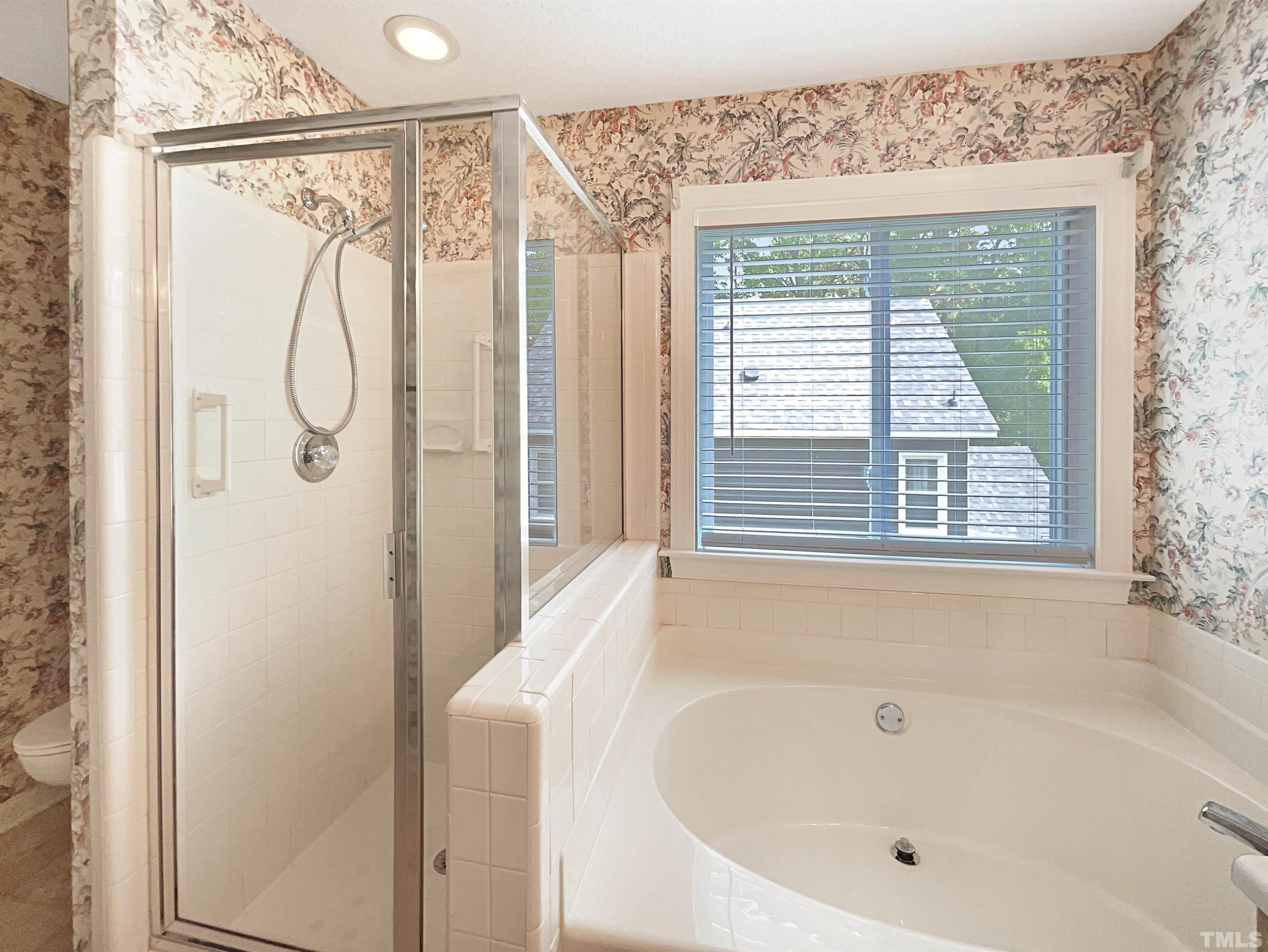 1749 Kingston Heath Way Raleigh, NC 27604 - Photo 18 of 19 a bathroom with a bathtub and a shower