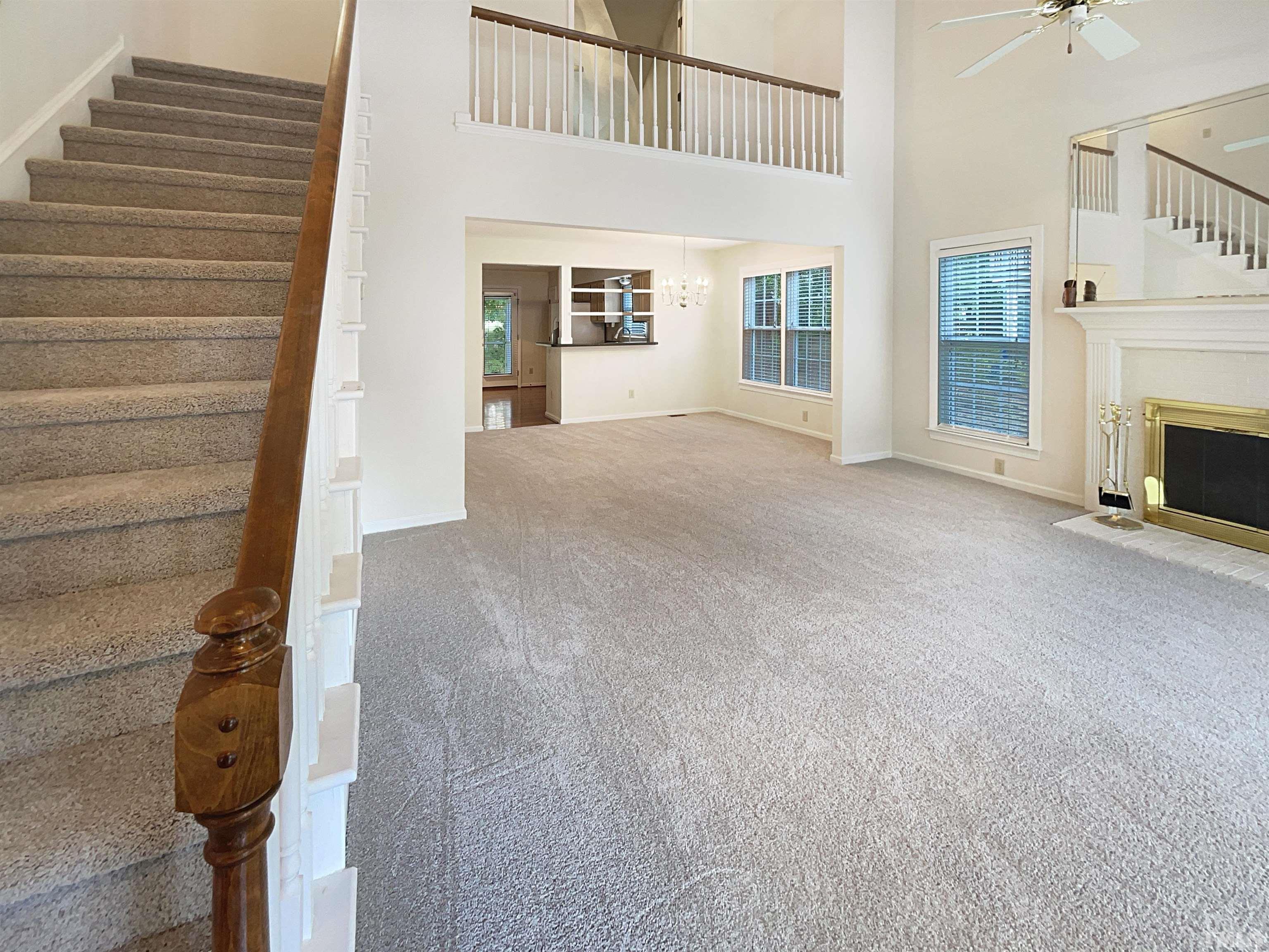 1749 Kingston Heath Way Raleigh, NC 27604 - Photo 6 of 19 a view of empty room with fireplace and fan