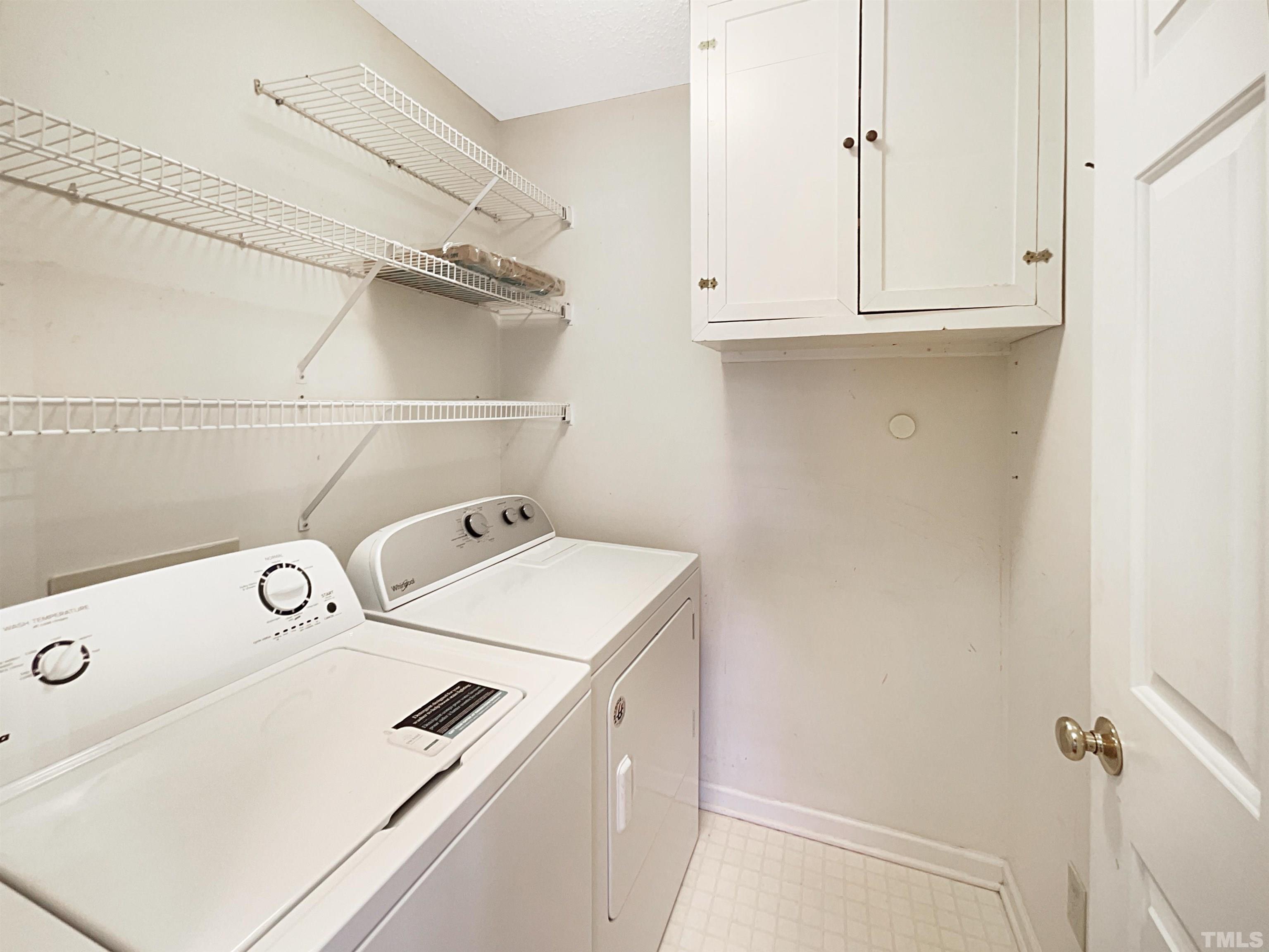 1749 Kingston Heath Way Raleigh, NC 27604 - Photo 8 of 19 a utility room with dryer and washer