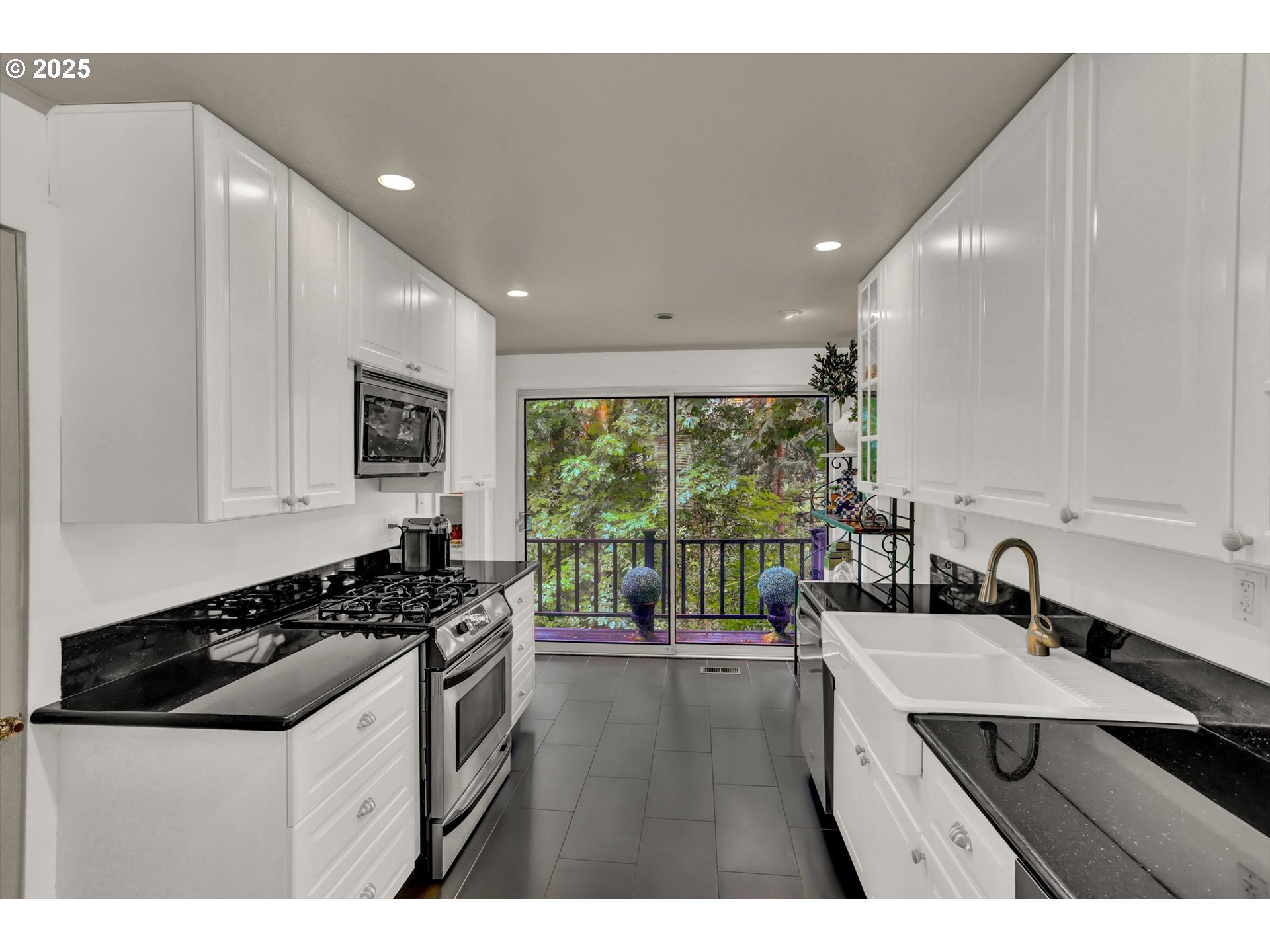 2271 Southwest Montgomery Drive Portland, OR 97201 - Photo 11 of 25 a kitchen with a sink stove and cabinets