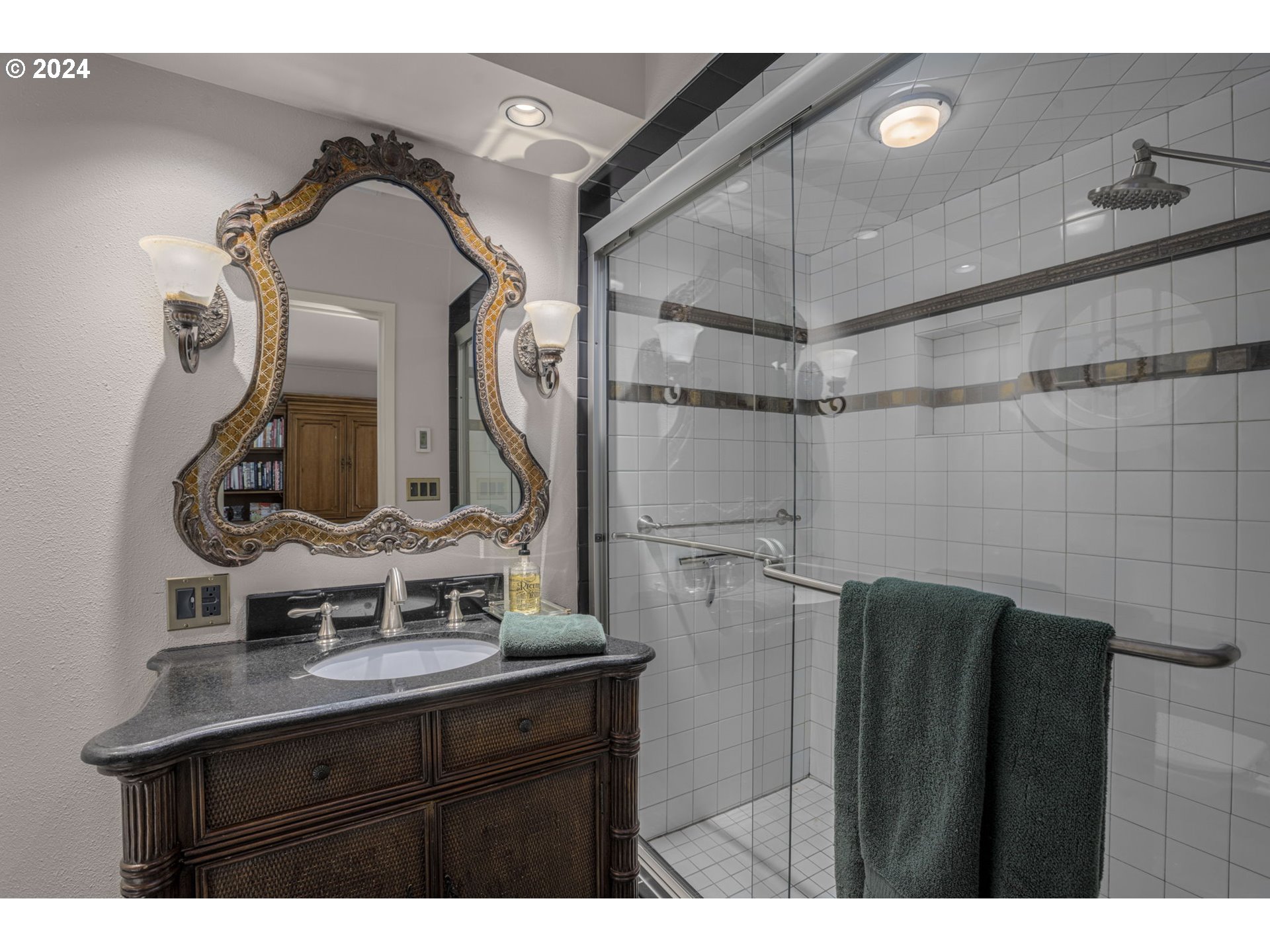 2271 Southwest Montgomery Drive Portland, OR 97201 - Photo 17 of 25 a bathroom with a sink vanity and a mirror