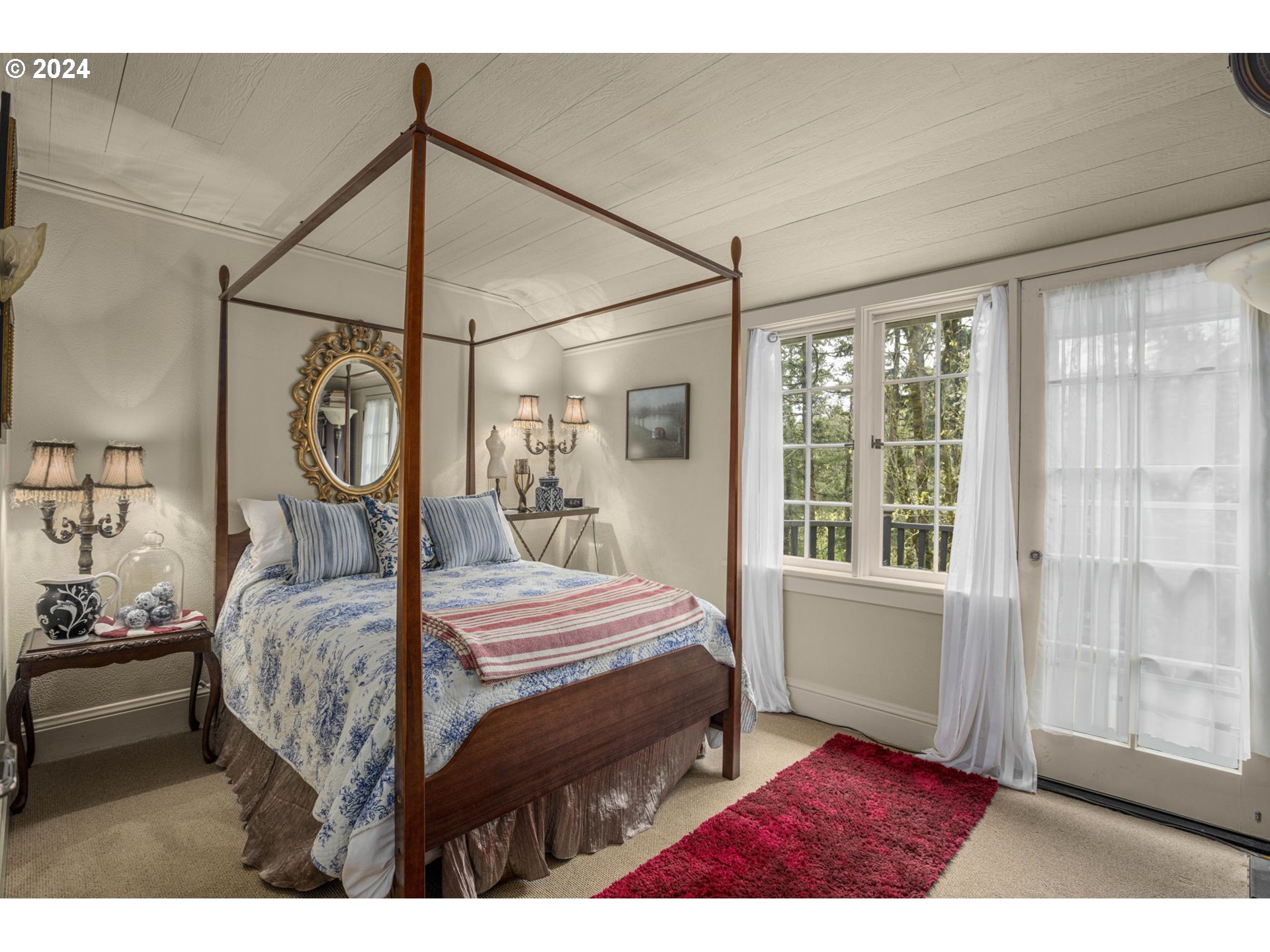 2271 Southwest Montgomery Drive Portland, OR 97201 - Photo 18 of 25 a bedroom with a bed a mirror and a window