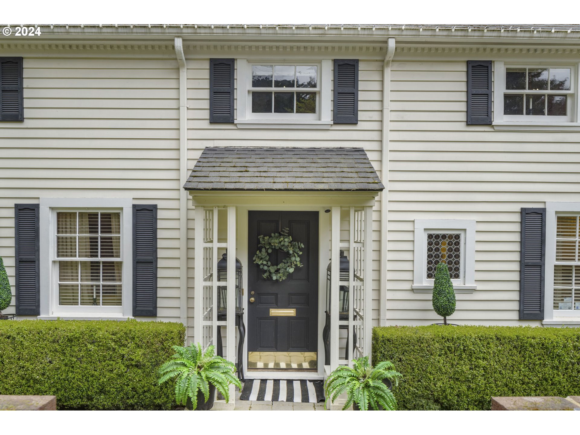 2271 Southwest Montgomery Drive Portland, OR 97201 - Photo 2 of 25 a view of a house with potted plants and a yard