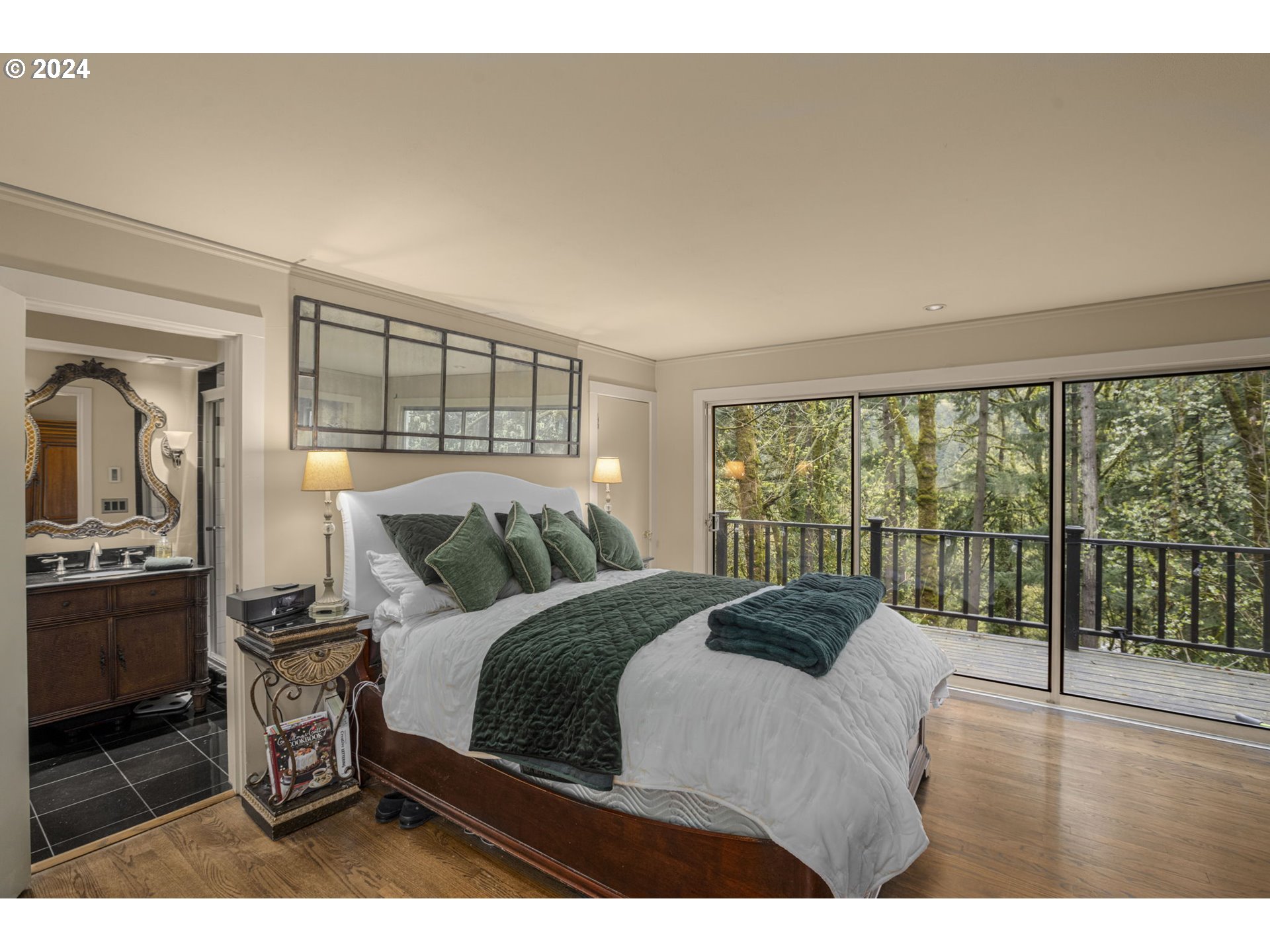 2271 Southwest Montgomery Drive Portland, OR 97201 - Photo 9 of 25 a bedroom with a large bed and a view of living room