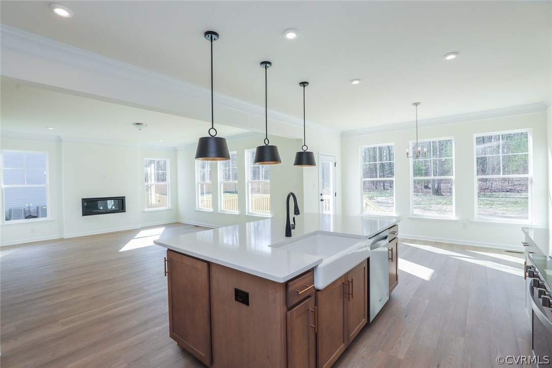 3825 Belspring Road Chester, VA 23831 - Photo 14 of 48 a kitchen with stainless steel appliances granite countertop a kitchen island a stove a sink and a wooden floors