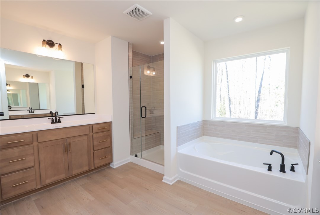 3825 Belspring Road Chester, VA 23831 - Photo 25 of 48 a spacious bathroom with a tub sink shower and mirror