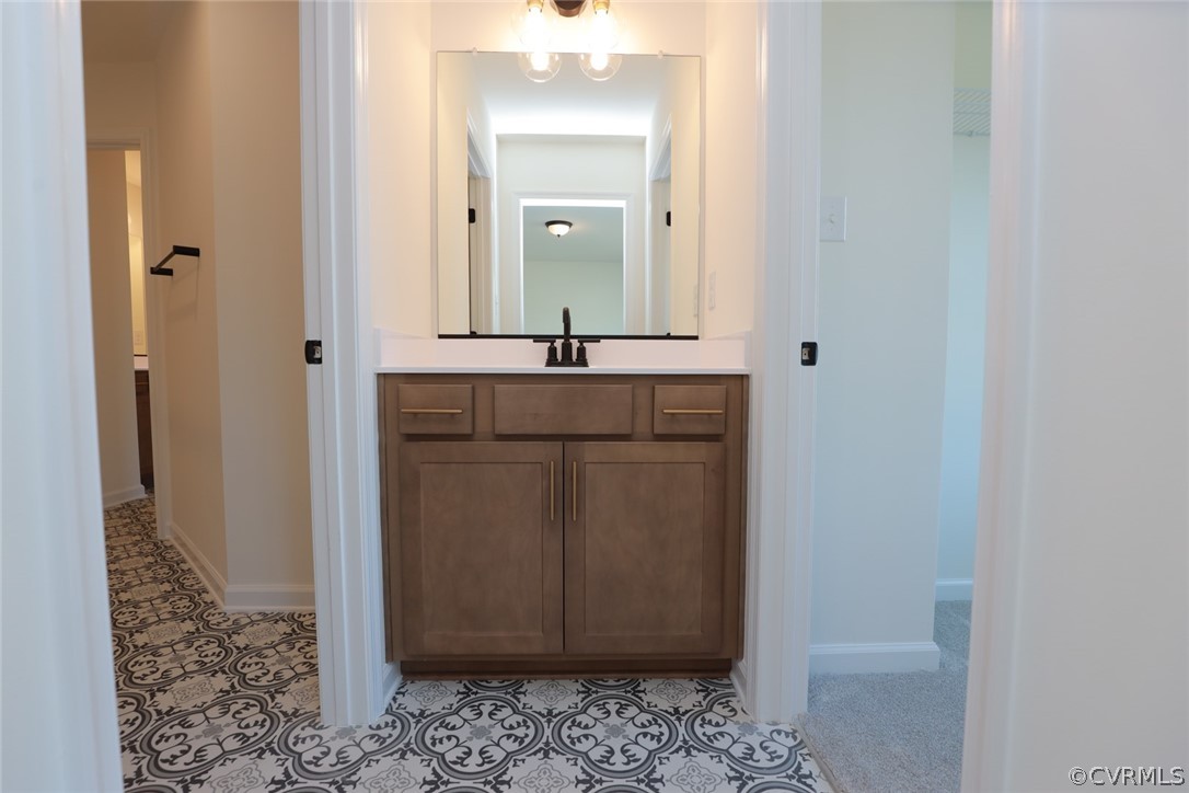 3825 Belspring Road Chester, VA 23831 - Photo 30 of 48 a bathroom with a sink and a mirror