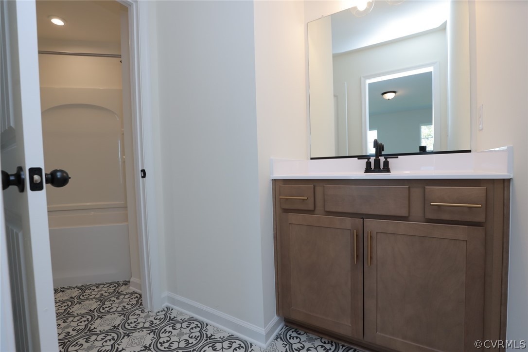 3825 Belspring Road Chester, VA 23831 - Photo 32 of 48 a bathroom with a sink and a mirror