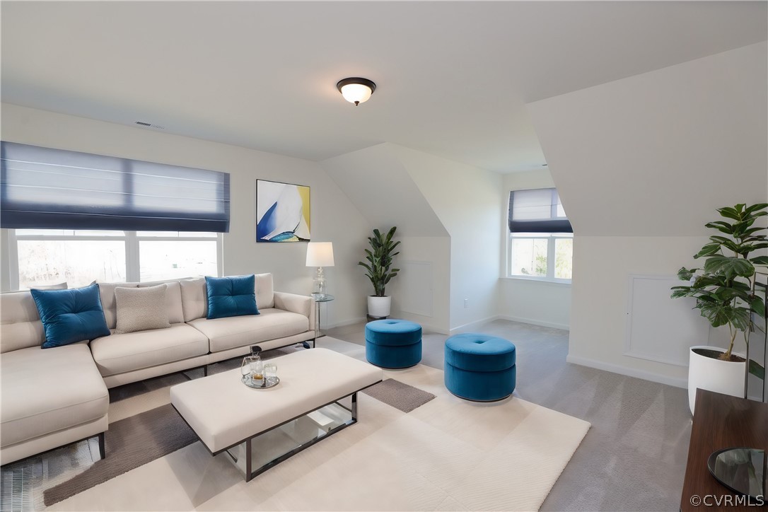 3825 Belspring Road Chester, VA 23831 - Photo 34 of 48 a living room with furniture a potted plant and a window