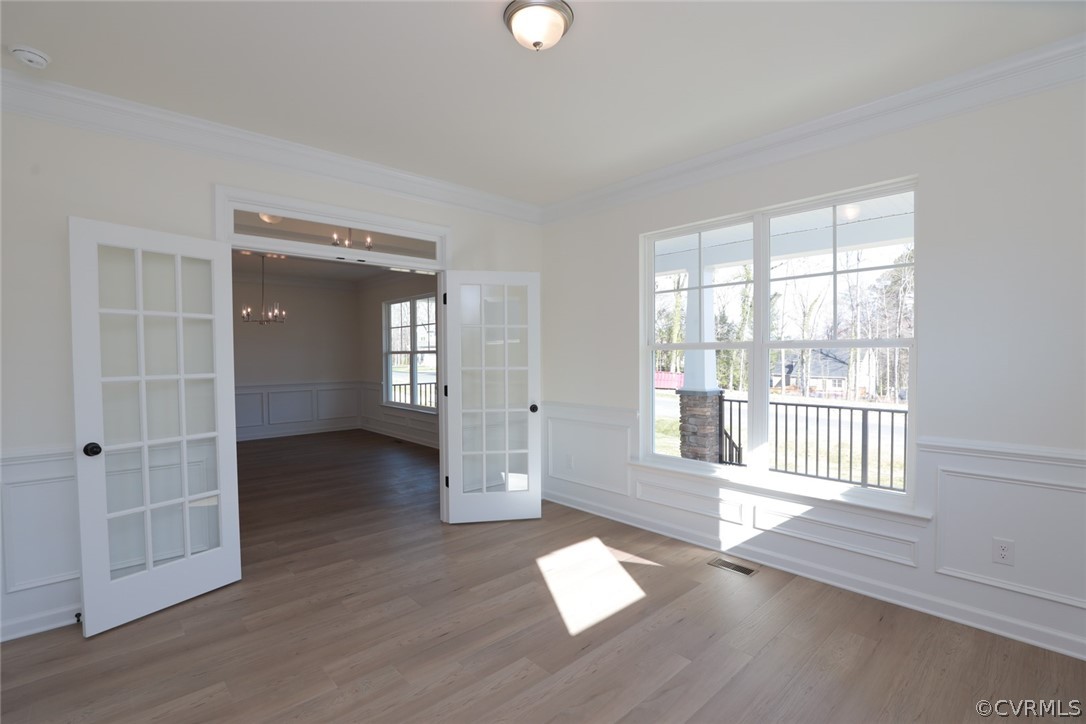 3825 Belspring Road Chester, VA 23831 - Photo 6 of 48 an empty room with wooden floor and windows