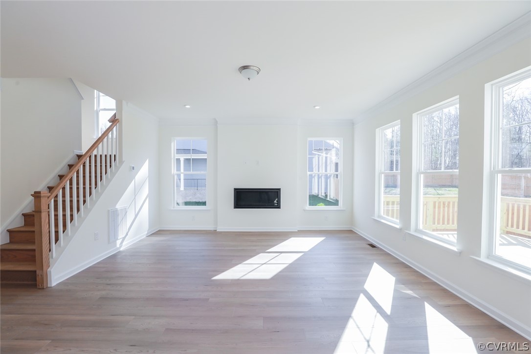 3825 Belspring Road Chester, VA 23831 - Photo 8 of 48 a view of an empty room with wooden floor and a window
