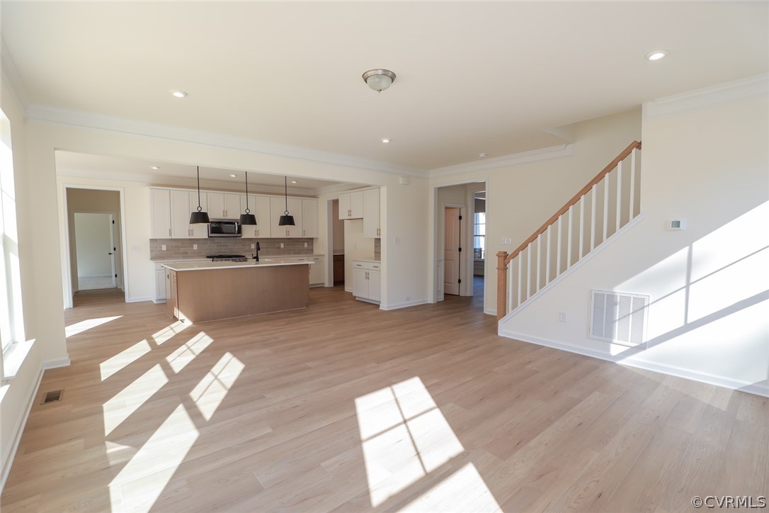 3825 Belspring Road Chester, VA 23831 - Photo 9 of 48 a view of a kitchen with wooden floor and electronic appliances