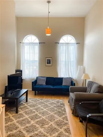 a living room with furniture and a window