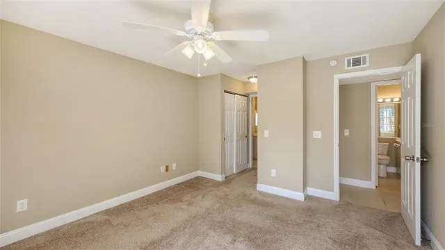 a bathroom with a bathtub shower sink vanity and toilet