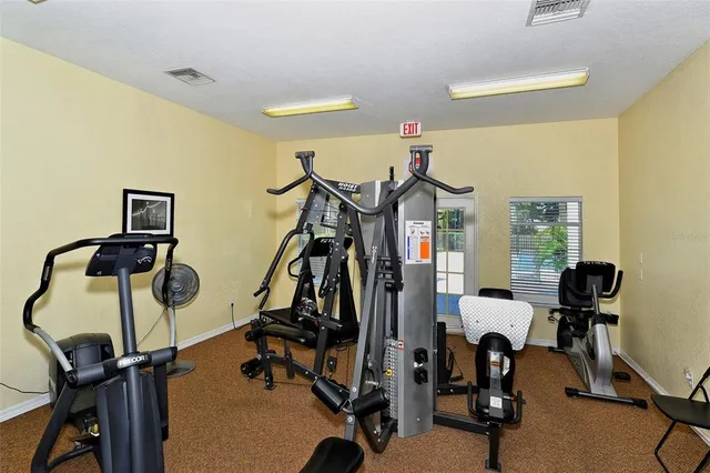 a front view of house with yard barbeque oven and outdoor seating