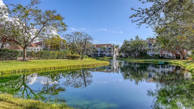 a view of a lake with a house in the background