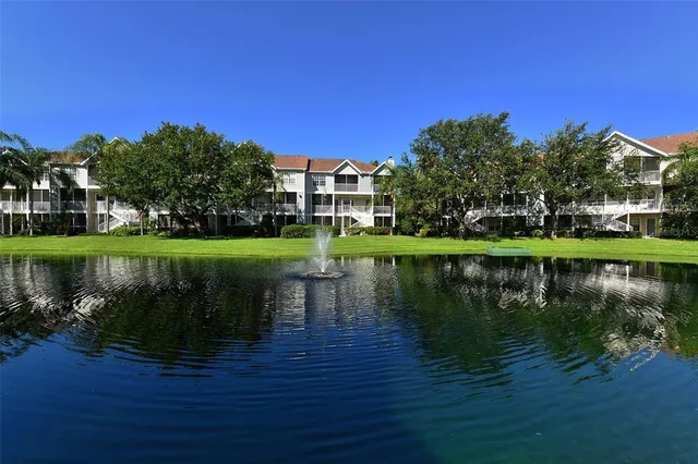 a view of a lake with houses in the background