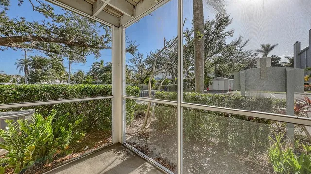 a view of a big room with a chandelier fan and a bathroom