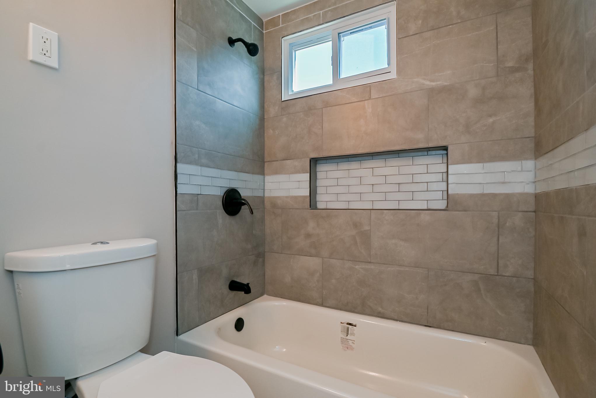 148 Harned Road Springfield, PA 19064 - Photo 22 of 52 Hall bath - ceramic tile floors & bath surround