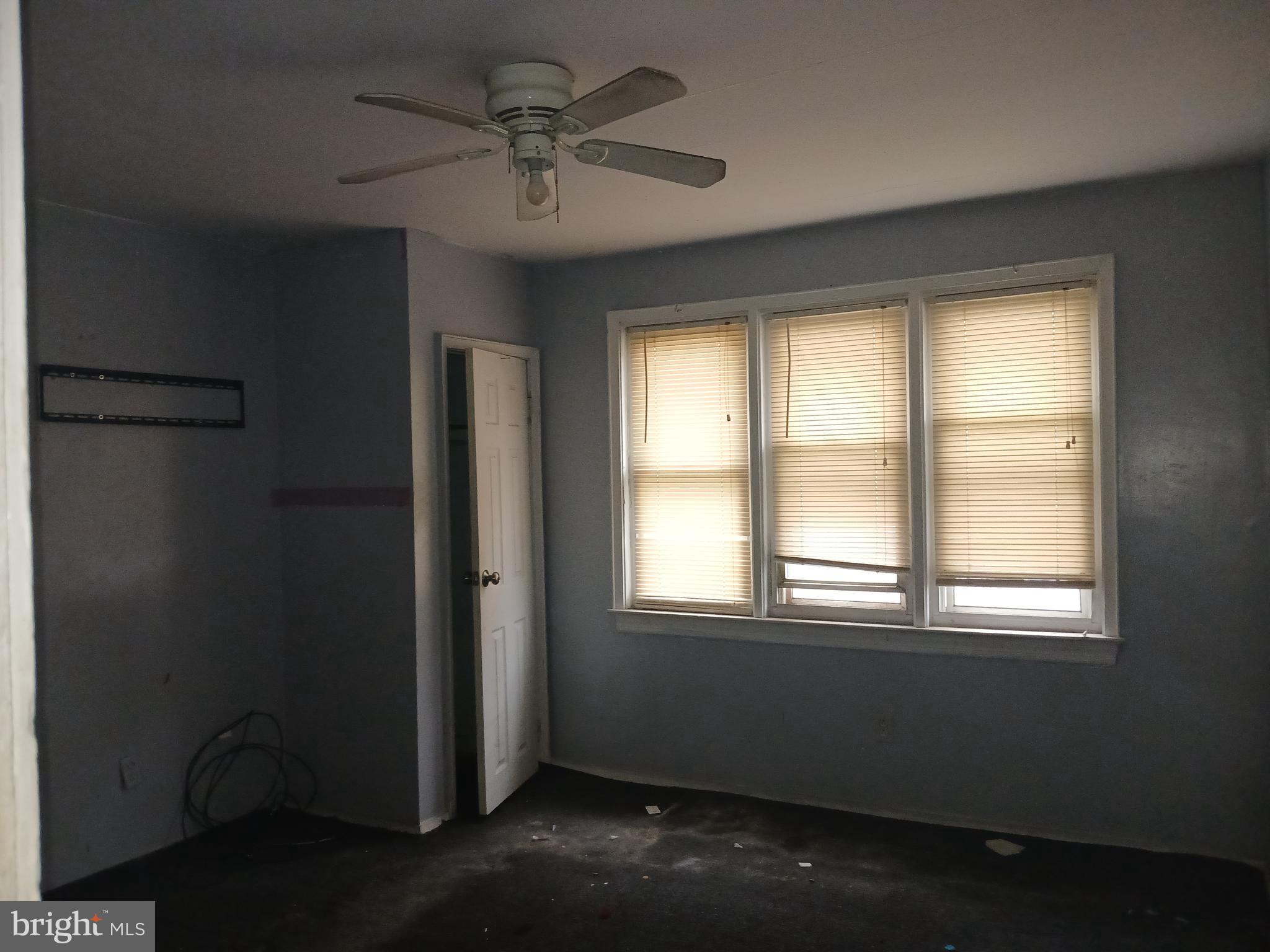 4003 Springdale Avenue Baltimore, MD 21207 - Photo 4 of 12 an empty room with a window