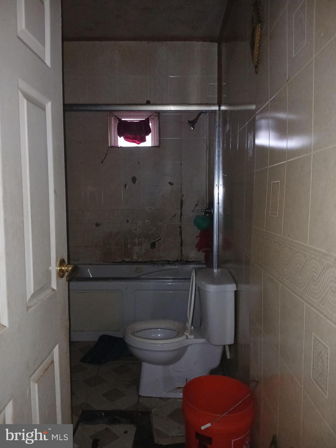 4003 Springdale Avenue Baltimore, MD 21207 - Photo 6 of 12 a bathroom with a toilet and a shower