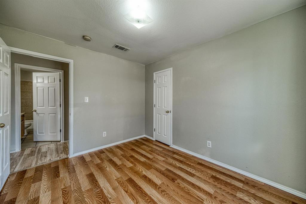 771 Olive Branch Road Weatherford, TX 76087 - Photo 13 of 20 a view of a room with wooden floor