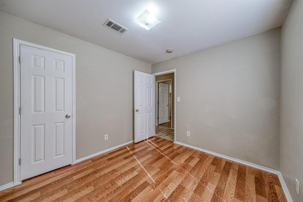 771 Olive Branch Road Weatherford, TX 76087 - Photo 15 of 20 a view of a room with wooden floor