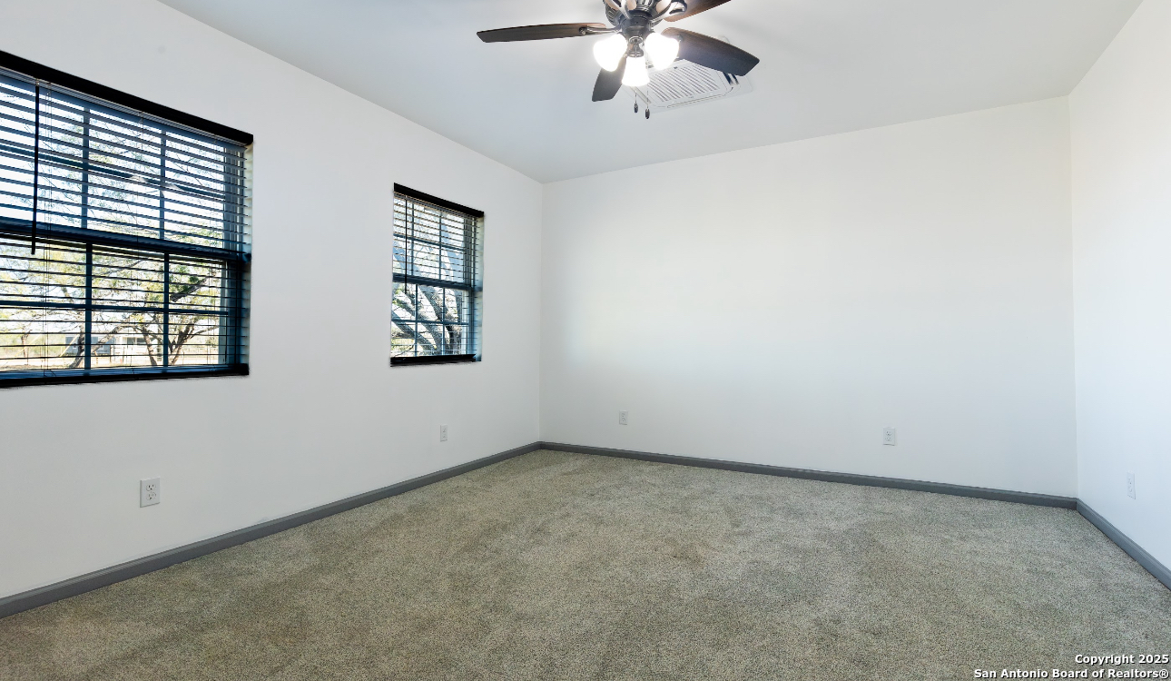 1510 Corgey Road Pleasanton, TX 78064 - Photo 13 of 34 an empty room with windows