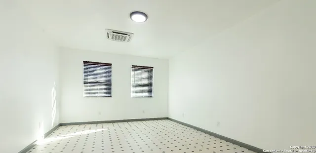 an empty room with windows