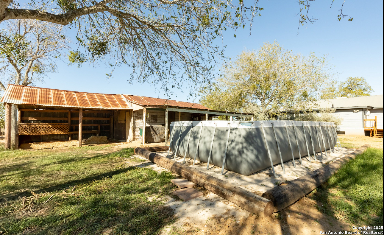 1510 Corgey Road Pleasanton, TX 78064 - Photo 24 of 34 a view of a house with a yard