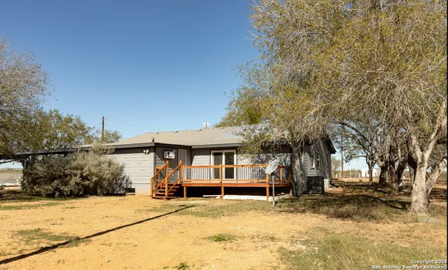 a view of a house with snow on the trees