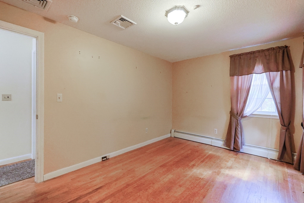 37 Oakleaf Drive Mansfield, MA 02048 - Photo 15 of 36 wooden floor in an empty room with a window