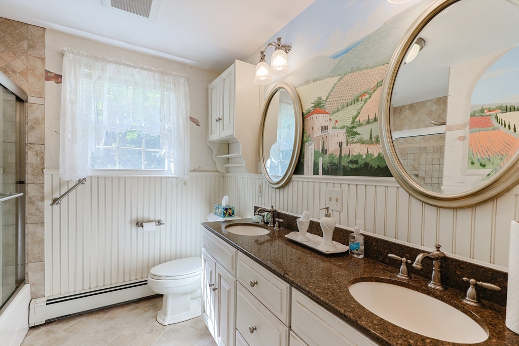 37 Oakleaf Drive Mansfield, MA 02048 - Photo 8 of 36 a bathroom with a double vanity sink and a mirror